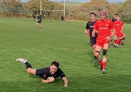 Oli Rothero scoring one of his two superb tries for Neyland. Picture Bill Carne